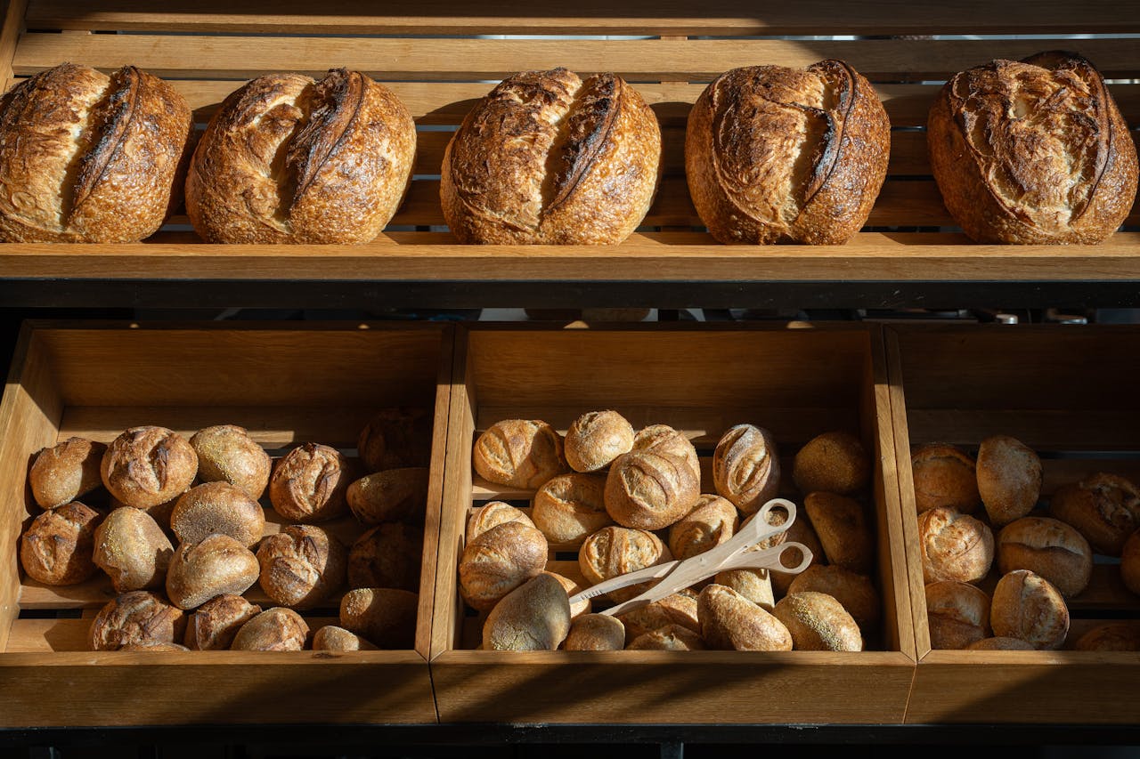 Freshly baked artisan breads displayed in a Berlin bakery, emphasizing variety and craftsmanship.